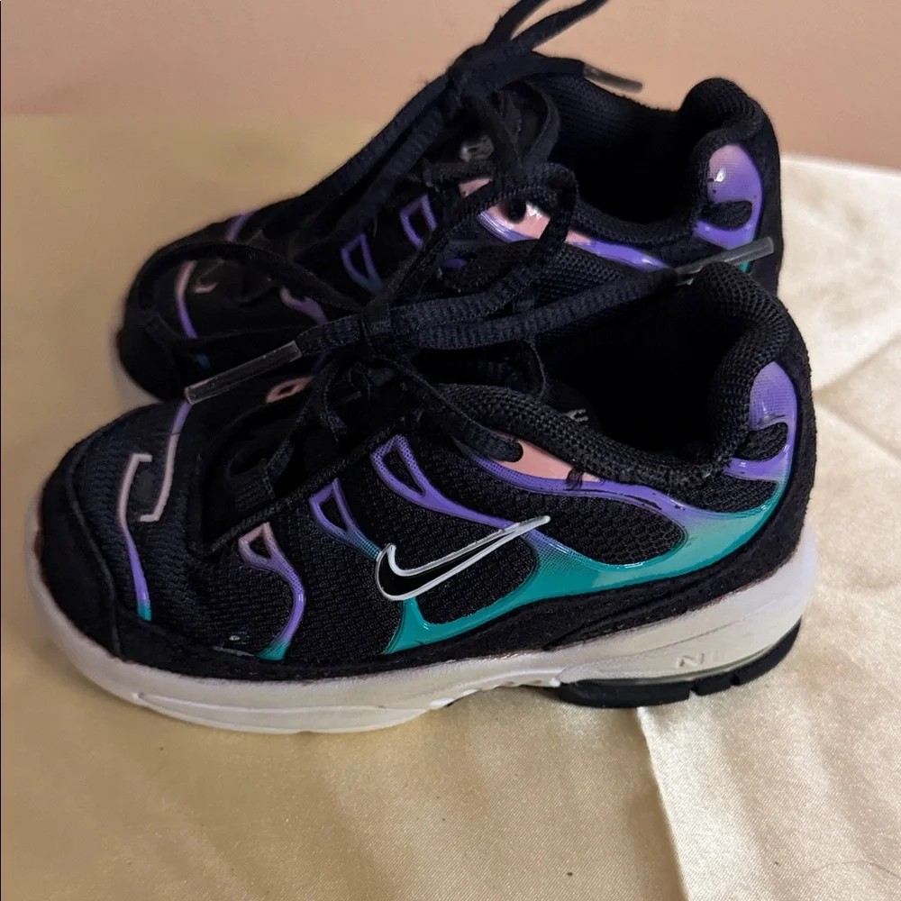 Nike Kids Black Sneakers with Iridescent Purple Accents